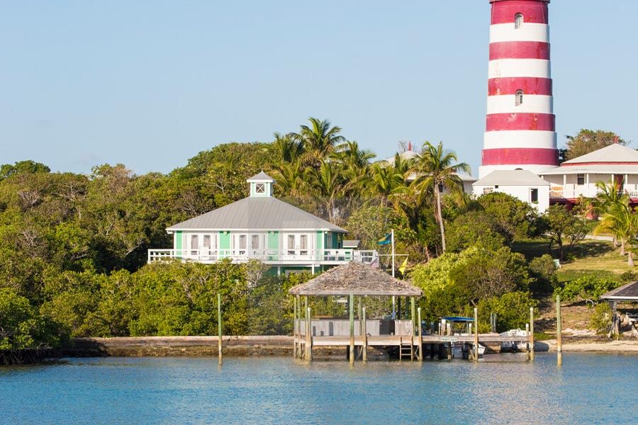 A lighthouse sits on top of a small island, offering incredible views and serving as a symbol of safety for ships navigating the surrounding waters.